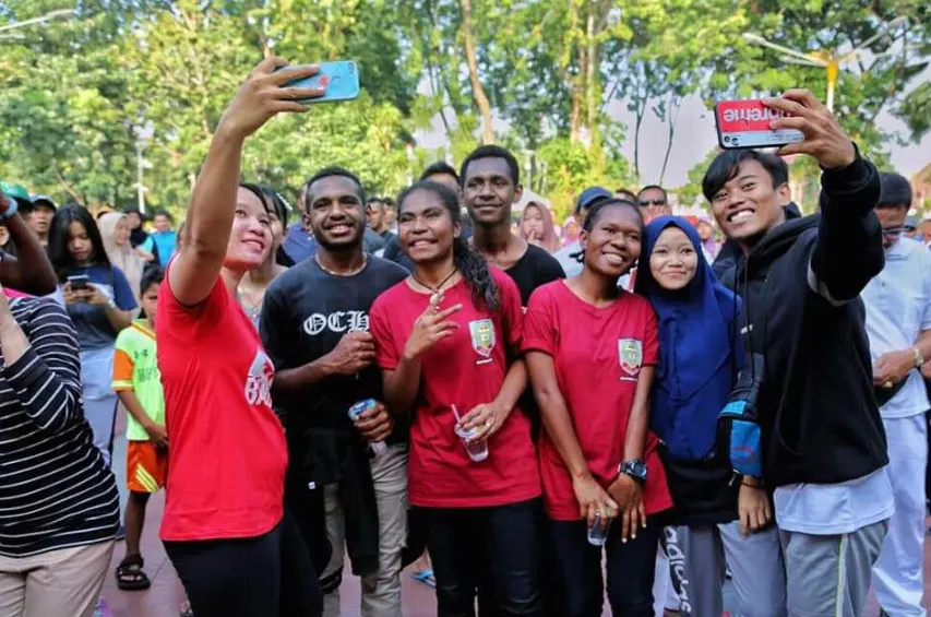 Group photo of an affinity-based community at an off-site outing.